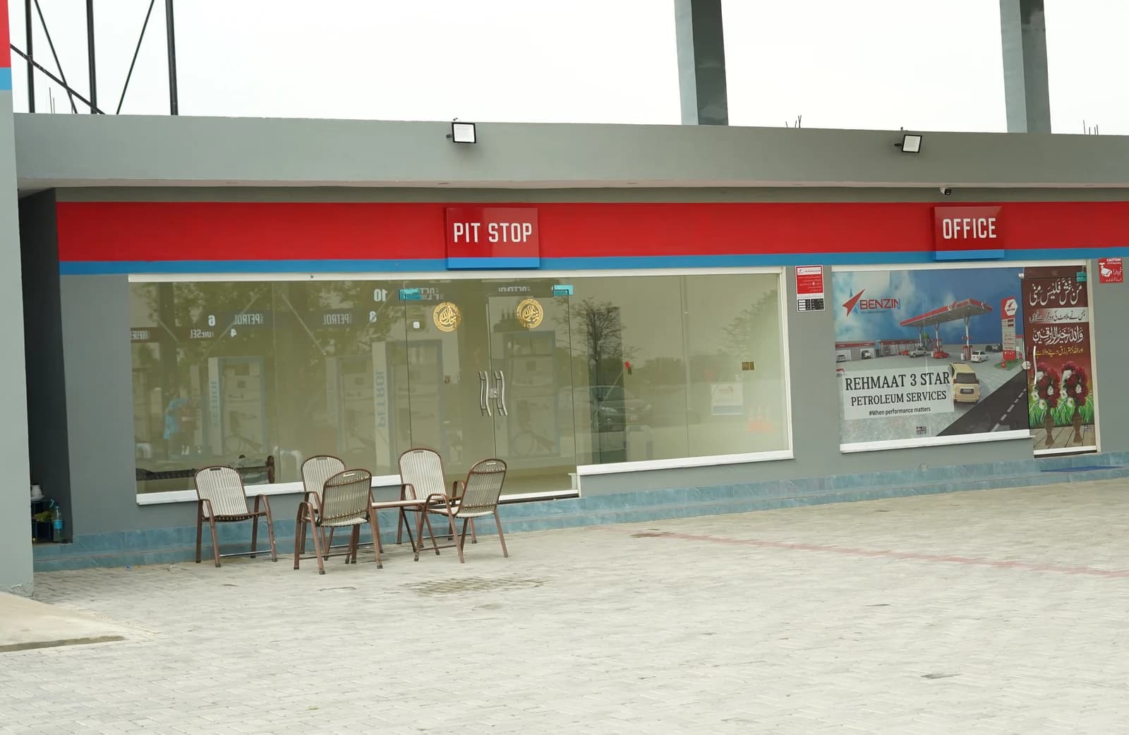 Benzin Pit Stop storefront with outdoor seating.